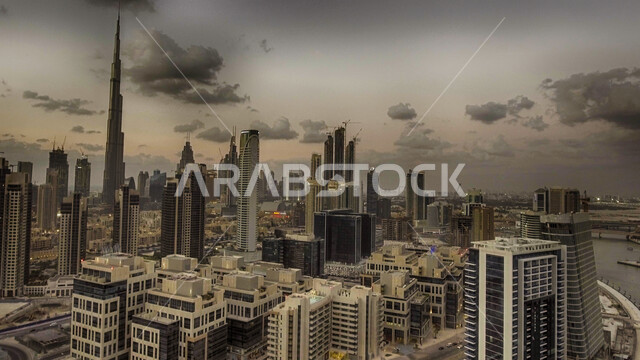 Urban progress and expansion in the United Arab Emirates, a black and white picture of towers and skyscrapers, architectural engineering art for residential and commercial buildings and facilities, attracting and attracting tourists from all over the world, Burj Khalifa in the city of Dubai