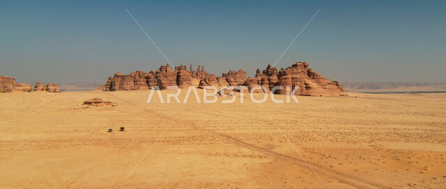Rock formations and formations in the desert areas of Saudi Arabia, dry and harsh desert climate, sand hills and dunes, soft golden sand, desert landscapes in the Kingdom of Saudi Arabia