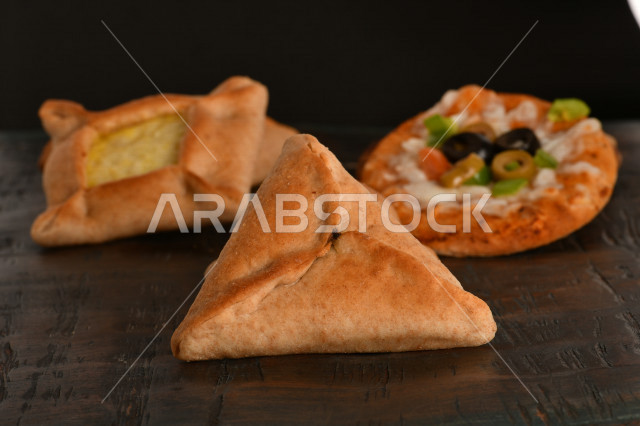 A group of delicious, quick and easy pastries or baked goods, with a variety of delicious foods, and pies stuffed with various ingredients, rich in flavors