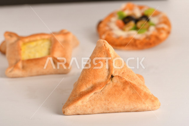 A group of delicious, quick and easy pastries or baked goods, with a variety of delicious foods, and pies stuffed with various ingredients, rich in flavors