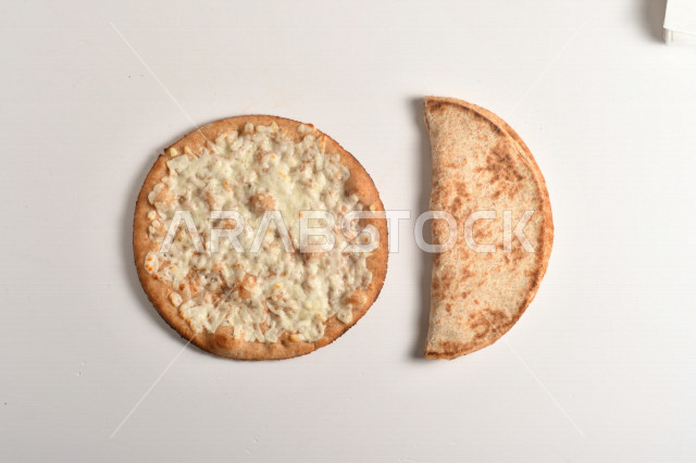 Delicious cheese manakish, delicious quick and easy baked goods, white cheese, white background
