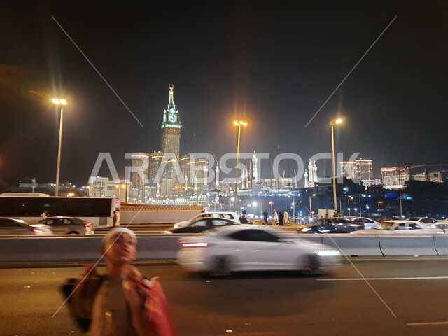 Urban growth and development in the Kingdom, the towers and hotels of Makkah Al-Mukarramah, the illuminated clock tower and skyscrapers, famous cities and landmarks in Saudi Arabia, contemporary architectural construction, wide streets and roads illuminated by high lights