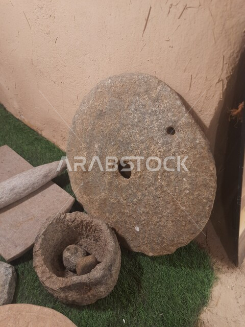 Antique Gulf equipment, a close-up of stone tools for grinding grain in the Kingdom of Saudi Arabia, tourism and touring in the Museum of the Live Air Museum in the village of Jarda Bin Ali in Al-Hajra Governorate in the Al-Bahah region, famous tourist areas and landmarks