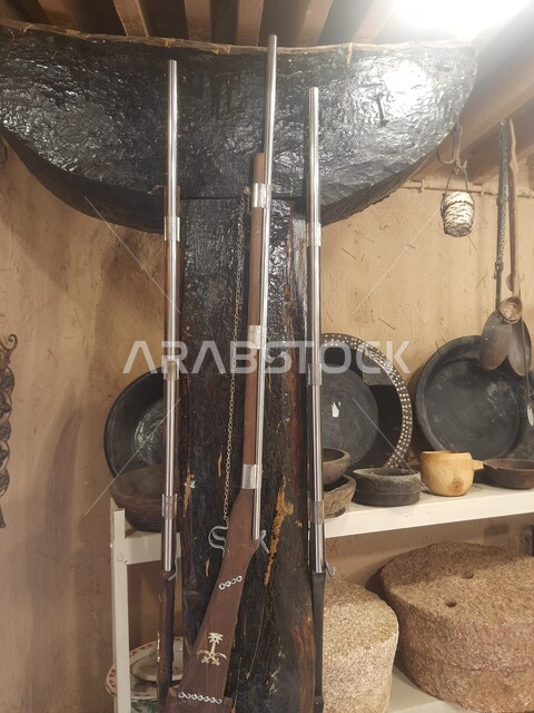 Famous tourist attractions and places, authenticity, nobility and Saudi heritage, popular traditional war tools displayed in the Museum of the Living Air Museum in the heritage village of Jarda Bin Ali in Al-Hajra Governorate, tourism in the Al-Bahah region in the Kingdom of Saudi Arabia