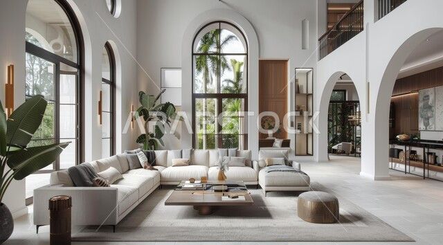 النوافذ والواجهات الزجاجية المطلة على الطبيعة، الاهتمام بنبات الزينة المنزلي، التصاميم الداخلية لغرف الجلوس على الطراز الحديث، غرفة معيشة مع أثاث منزلي فاخر باللون الابيض، ديكور داخلي راقي للفلل والشقق السكنية في المملكة العربية السعودية