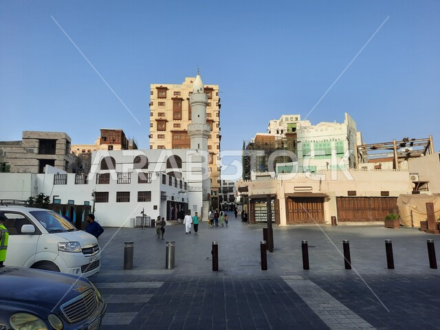 Car traffic in the streets and roads, monuments and archaeological places in the Kingdom of Saudi Arabia, heritage buildings in the Al-Balad neighborhood, interest in infrastructure, paved roads in the historic city of Jeddah