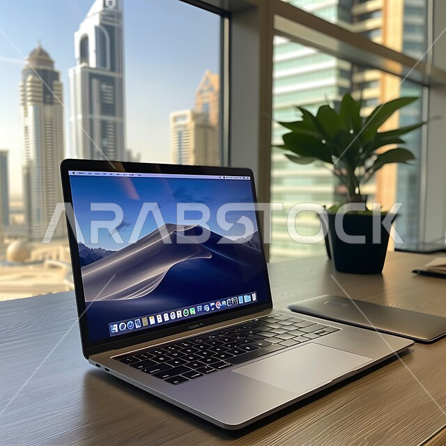 Office desk with large glass front, office desk equipped with office supplies, working on laptop, using modern technical devices in offices, administrative professions and jobs, high-end room decorations, designs and furniture