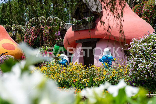 3D models of the Smurfs’ houses inside the Miracle Garden, spending enjoyable times in public areas, famous tourist attractions, distinguished agricultural engineering in the Smurfs Village in Dubai, interest in planting flowers in gardens in the United Arab Emirates, ideal entertainment destinations for children