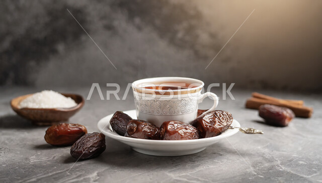 Local products and crops of Saudi Arabia, fresh dates with a cup of tea, hot healthy drinks, a meal with high nutritional value, a healthy and useful breakfast