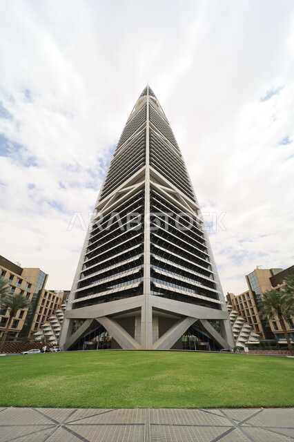 Al-Faisaliah Tower in the city of Riyadh, urban growth and progress in the Kingdom of Saudi Arabia, architectural engineering art of towers and skyscrapers, interest in afforestation and planting green plants, famous tourist attractions