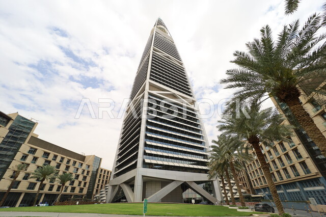 Al-Faisaliah Tower in the city of Riyadh, urban growth and progress in the Kingdom of Saudi Arabia, architectural engineering art of towers and skyscrapers, interest in afforestation and planting green plants, famous tourist attractions