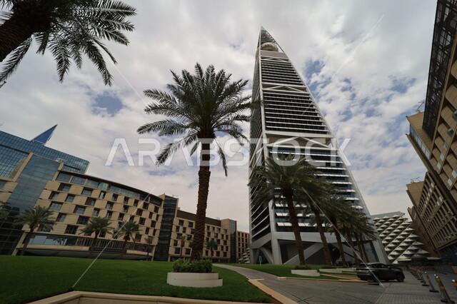 Al-Faisaliah Tower in the city of Riyadh, urban growth and progress in the Kingdom of Saudi Arabia, architectural engineering art of towers and skyscrapers, interest in afforestation and planting green plants, famous tourist attractions