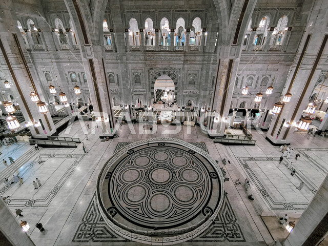 King Abdullah's expansion of the Grand Mosque in Mecca, luxurious Islamic gypsum decorations on the ceilings, the Grand Mosque in Mecca in the Kingdom of Saudi Arabia, sacred religious landmarks and places, the concept of worship and drawing closer to God Almighty