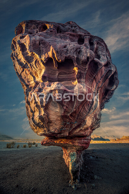 The view of clouds in the sky at night time, natural rock formations and formations in the Kingdom of Saudi Arabia, a large rock in the Tabuk desert, famous landmarks and tourist places