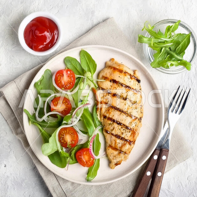 Distinctive dishes and recipes in the kitchens of the Kingdom of Saudi Arabia, delicious Eastern Arab food, a plate of fillet pieces with vegetables, a picture from the top of healthy chicken meals, fast food restaurants, a white background