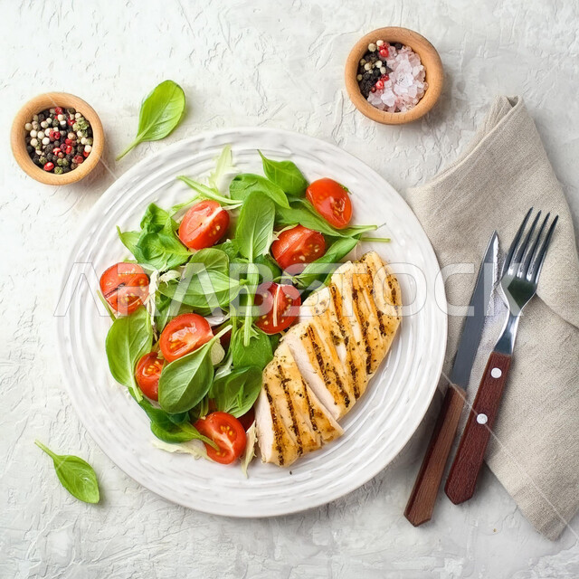 Distinctive recipes in the kitchens of the Kingdom of Saudi Arabia, delicious Eastern Arab food, a plate of fillet pieces with vegetables, a picture from the top of healthy chicken meals, fast food restaurants, a white background