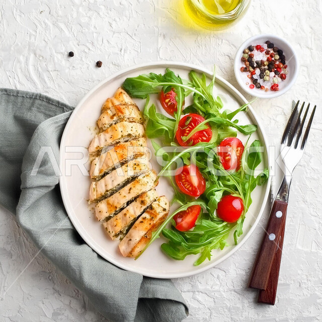 Distinctive recipes in the kitchens of the Kingdom of Saudi Arabia, delicious Eastern Arab food, a plate of fillet pieces with vegetables, a picture from the top of healthy chicken meals, fast food restaurants, a white background