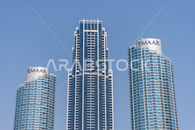 Innovative engineering designs for modern high-rise towers, urban growth and progress in the city of Dubai, architectural art in building skyscrapers in the Dubai Mall, tourist and entertainment places in the United Arab Emirates