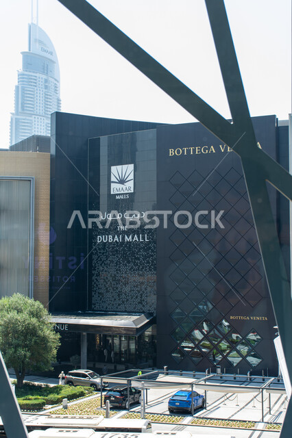 Introductory and guidance panels at entrances and exits, the external sign of the Dubai Mall in Arabic and English in the city of Dubai, shopping centers and luxury stores, places for family entertainment activities in the United Arab Emirates