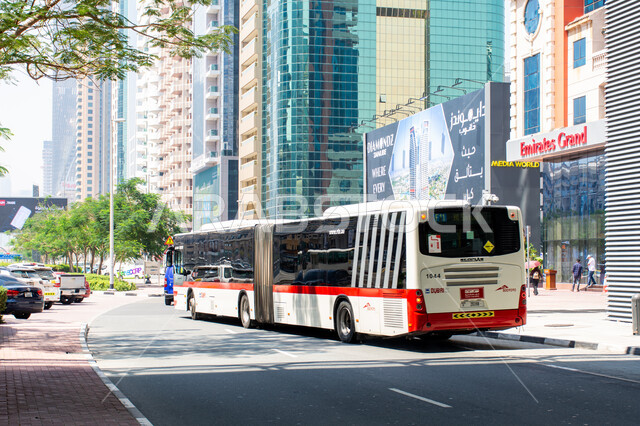 Urban renaissance in the United Arab Emirates, growth and progress in the streets of Dubai, means of transportation and public transportation within cities, using the bus to move from one place to another