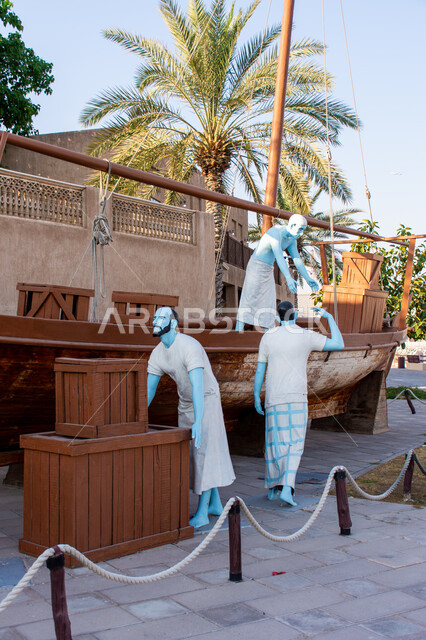 Embodying the ancient fishing profession, statues of Emirati figures next to a wooden boat inside the Shindagha Historical Museum, historical buildings in the Dubai Creek district, famous tourist landmarks in the United Arab Emirates, Sheikh Saeed Al Maktoum House