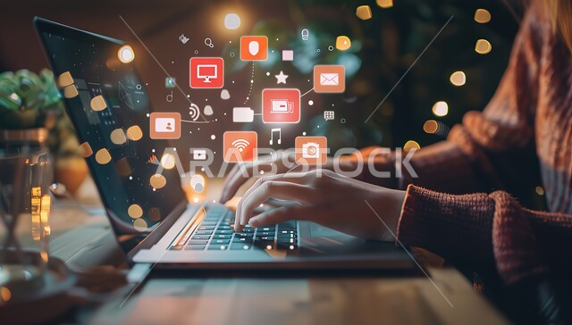 مجموعة أيقونات خاصة بتطبيقات الحاسوب، صورة مقربة ليدين شاب عربي خليجي سعودي يقوم بالعمل على جهاز اللابتوب، احتراف وظائف الحواسيب و تكنولوجيا المعلومات ، التسويق الالكتروني و تصفح الانترنت
