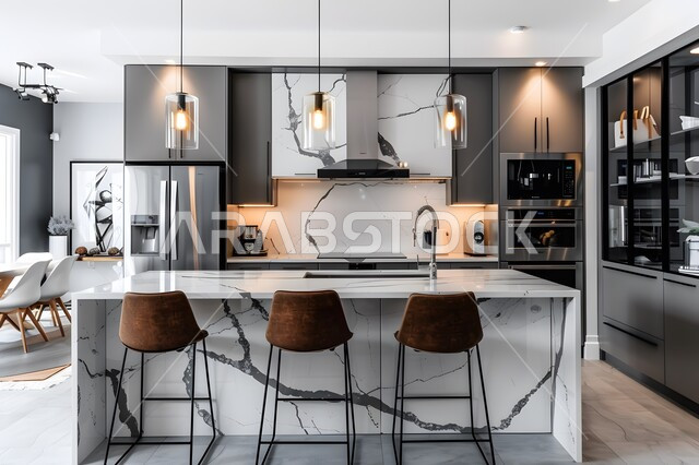 تصميم داخلي حديث لمطبخ معاصر, الديكورات العصرية للمطابخ الفاخرة في المملكة العربية السعودية، الأضواء المعلقة وتناسق الألوان بشكل جذاب, طاولة مطبخية باللون الأبيض