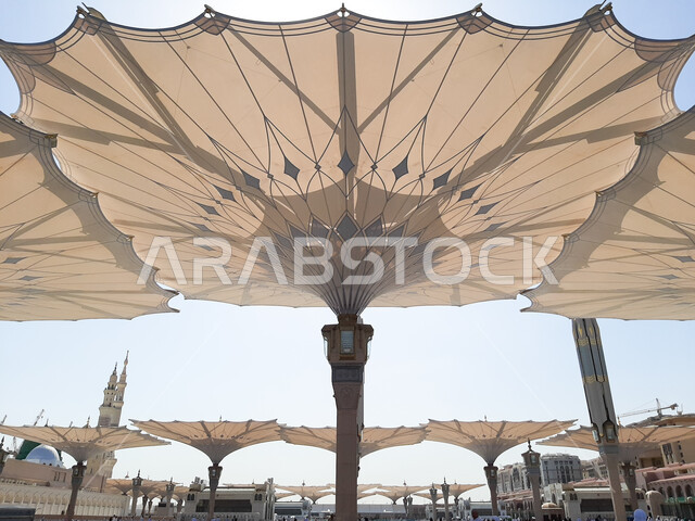 Open electronic umbrellas in the courtyard of the Prophet’s Mosque in Medina, the Prophet’s Mosque in the Kingdom of Saudi Arabia, the Noble Prophet’s Mosque, famous Saudi Islamic holy places