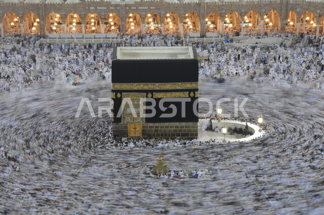 Performing Hajj and Umrah rituals, circumambulating the Holy Kaaba in Mecca, gathering of pilgrims and pilgrims in the courtyard of the Grand Mosque, the Holy Mosque of Mecca in the Kingdom of Saudi Arabia, sacred Islamic religious monuments and places, worship and getting closer to God Almighty.