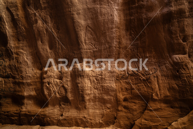 The concept of tourism in the Kingdom of Saudi Arabia, historical monuments and archaeological sites, historical inscriptions on rocks in Jubbah in the city of Hail, drawings of ancient peoples, rock formations and formations