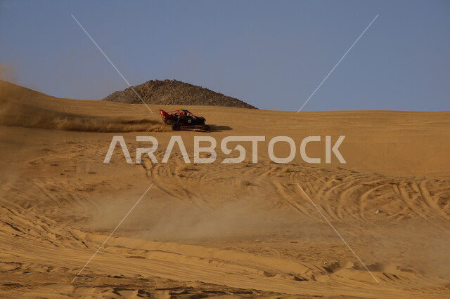 The Dakar Rally race in the Kingdom of Saudi Arabia, exciting challenges and entertainment activities, the sport of racing dirt cars in desert areas, racing on soft golden sand, famous competitions and events, the World Rally Championship.