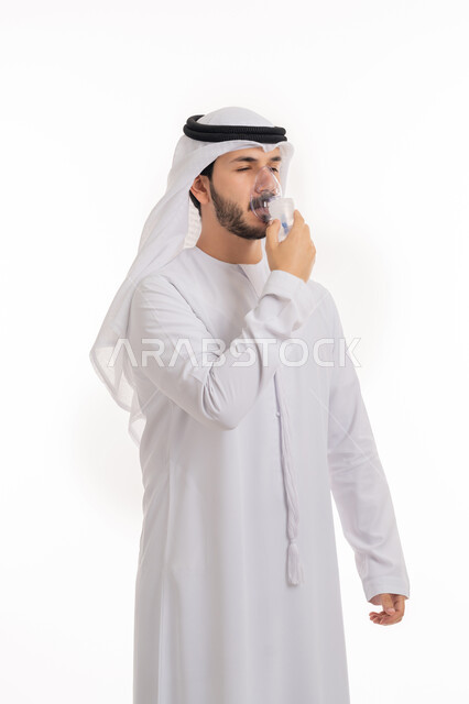 Providing home health services to the patient, treating cases of shortness of breath, ensuring comfort for the respiratory muscles using a respirator, a portrait of an Arab Emirati Gulf man wearing a kandora and ghutra, inhaling shortness of breath medications using an oxygen mask, white background.
