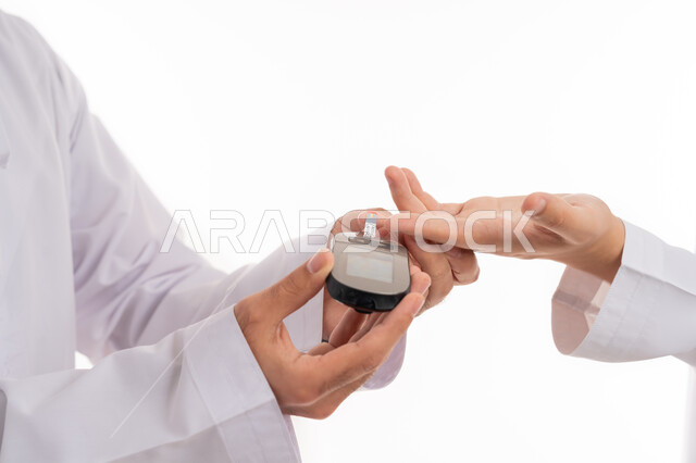 Scientific and technical development in rapid testing devices, the concept of caring for physical health, a close-up portrait of an Arab Gulf Emirati man testing blood sugar, the use of modern electronic devices for diabetics, white background