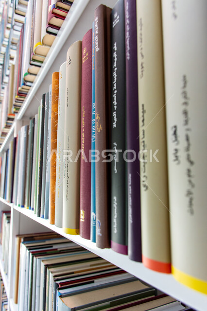 Organizing and arranging the bookshelves in the Mohammed bin Rashid Library, rich in magazines and dictionaries in the Emirate of Dubai, a distinguished knowledge edifice and a famous cultural landmark, a beacon of culture and thought, the architectural art of libraries, museums and exhibitions in the United Arab Emirates, a place for readers and lovers of science and knowledge