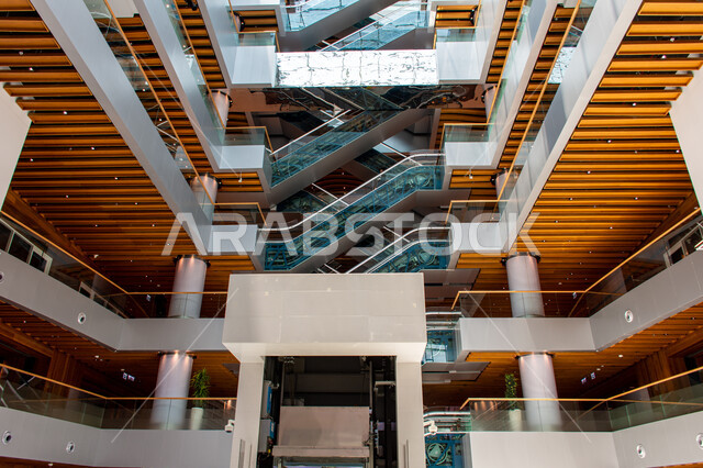Escalators in the Mohammed bin Rashid Library, rich in magazines and dictionaries in the Emirate of Dubai, scientific libraries in the United Arab Emirates, luxurious interior decorations and designs, a place for readers and lovers of science and knowledge, providing comfort for readers, acquiring knowledge and developing linguistic stock
