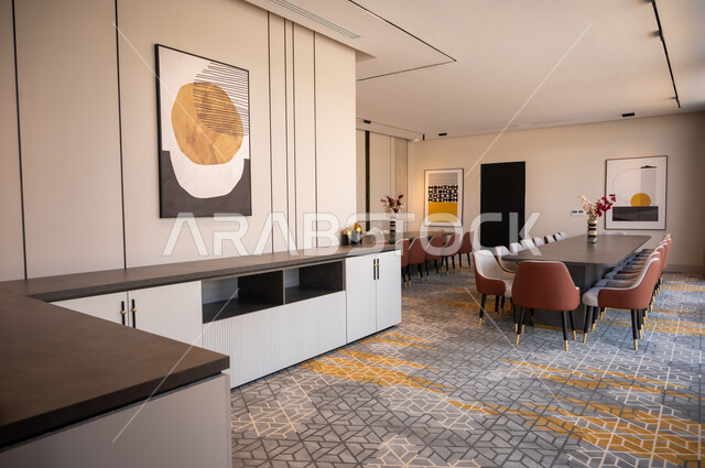 الفن الهندسي المعماري المتطور، غرف مكتبية بتصاميم وديكورات داخلية فخمة مع أثاث فاخر ومريح، غرفة اجتماعات واسعة مع طاولات محاطة بكراسي، لوحات فنية معلقة، التصميم العصري الحديث للمكاتب في الشركات في السعودية