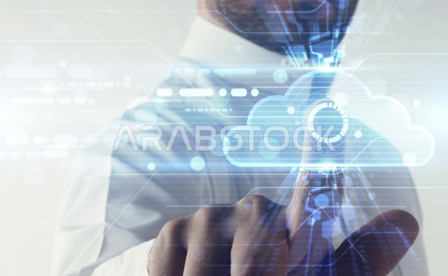 صورة مقربة لرجل عربي سعودي خليجي ،يستخدم تقنية الهولوجرام ، ثلاثية الأبعاد للتعامل مع السحابة الالكترونية ، استخدام تقنية الهولوجرام .