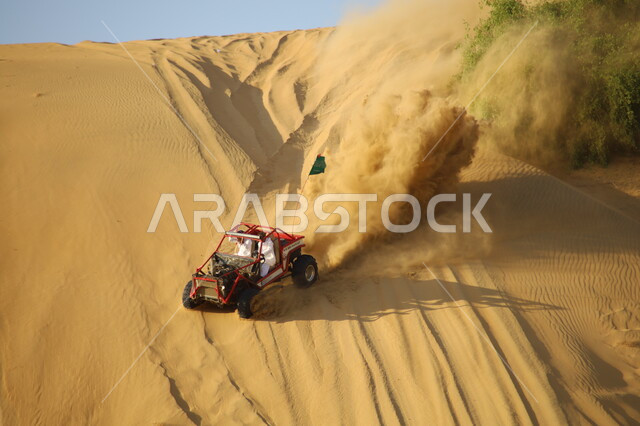 Going on adventures with a four-wheel drive vehicle in the deserts of the Kingdom, participating in Saudi races, the hobby of car racing, driving vehicles in the Nawan desert in the Al-Baha region, riding a car on dunes and sand hills, entertainment activities that attract tourists.