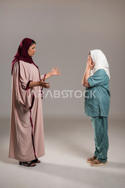 An attempt to control oneself and suppress anger, a portrait of a Saudi Gulf Arab young woman raising her hands in annoyance to the Filipino maid to ask her to stop making mistakes, gestures of reproach, reprimand and rejection, full-length body image, white background