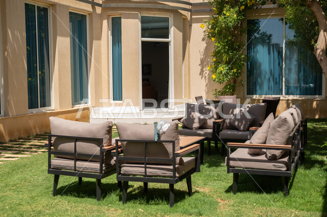 Places for rest and relaxation, modern designs for distinctive seats in the outdoor garden, trees and green plants surrounding tourist residential apartments and villas, luxurious designs and decorations, modern architectural art.