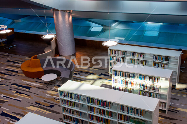 Arrangement and organization of bookshelves in the Mohammed bin Rashid Library, rich in magazines and dictionaries in the Emirate of Dubai, a distinguished knowledge edifice and a famous cultural landmark, a beacon of culture and thought, the architectural engineering art of libraries, museums and exhibitions in the United Arab Emirates, a place for readers and lovers of science and knowledge