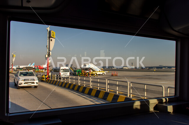 Maintenance vehicle in Terminal 02 runway at Dubai International Airport, the concept of tourism in the United Arab Emirates, Emirati airlines and companies, landing and take-off runway, means of transportation and air transportation, providing advanced services for easy movement between countries.