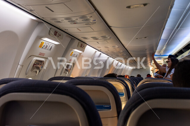 Means of air transport and trips around the world, modern decorations and designs, an inside picture of airplane seats, Emirati Gulf tourist airlines, advanced and comfortable engineering design