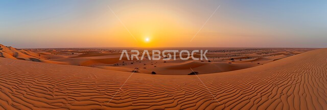 Landscape and soft golden sand in the desert, a panoramic image of sand hills and natural desert terrain in the Kingdom of Saudi Arabia, mountain peaks and heights at sunset, nature background