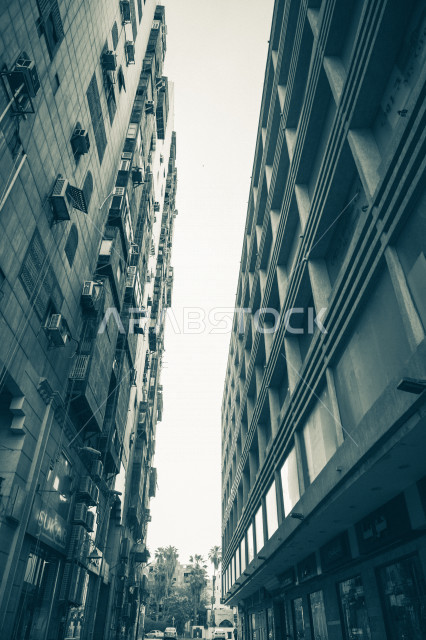 A wonderful picture of a corridor between two apartment buildings in the streets of Jeddah, Saudi Arabia