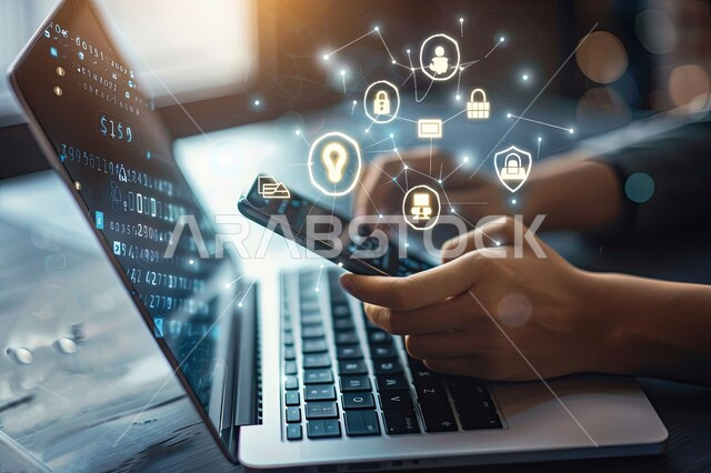 Mobile phone use, electronic development and technological growth, a close-up image of a man’s hands doing work and tasks on a laptop, the concept of computer programming, holographic digital symbols for computer icons and Internet networks