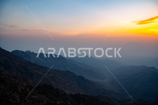 Mountainous nature in the Kingdom of Saudi Arabia, rock formations and formations, heights and peaks, foggy atmosphere on the Hada Mountains in the city of Taif at sunset, famous tourist places and landmarks