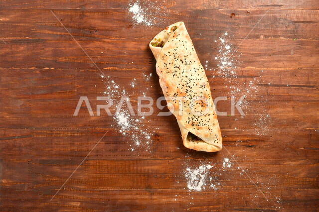 Delicious falafel sandwich stuffed inside a skillfully baked dough, food preparation method, Levantine Arabic food