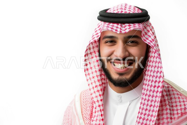 The concept of masculinity and self-confidence, concern for elegance and external appearance, a close-up portrait of a smiling Saudi Gulf Arab man wearing a shemagh and traditional thobe, looking at the camera with gestures of pleasure and joy, white background