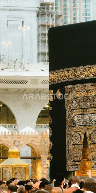 A group of pilgrims in the Holy Kaaba in the Holy Mosque in Mecca in the Kingdom of Saudi Arabia, performing Hajj and Umrah rituals, circumambulation around the Holy Kaaba, worship and getting closer to God, Islamic matters and worship, Islamic holy places